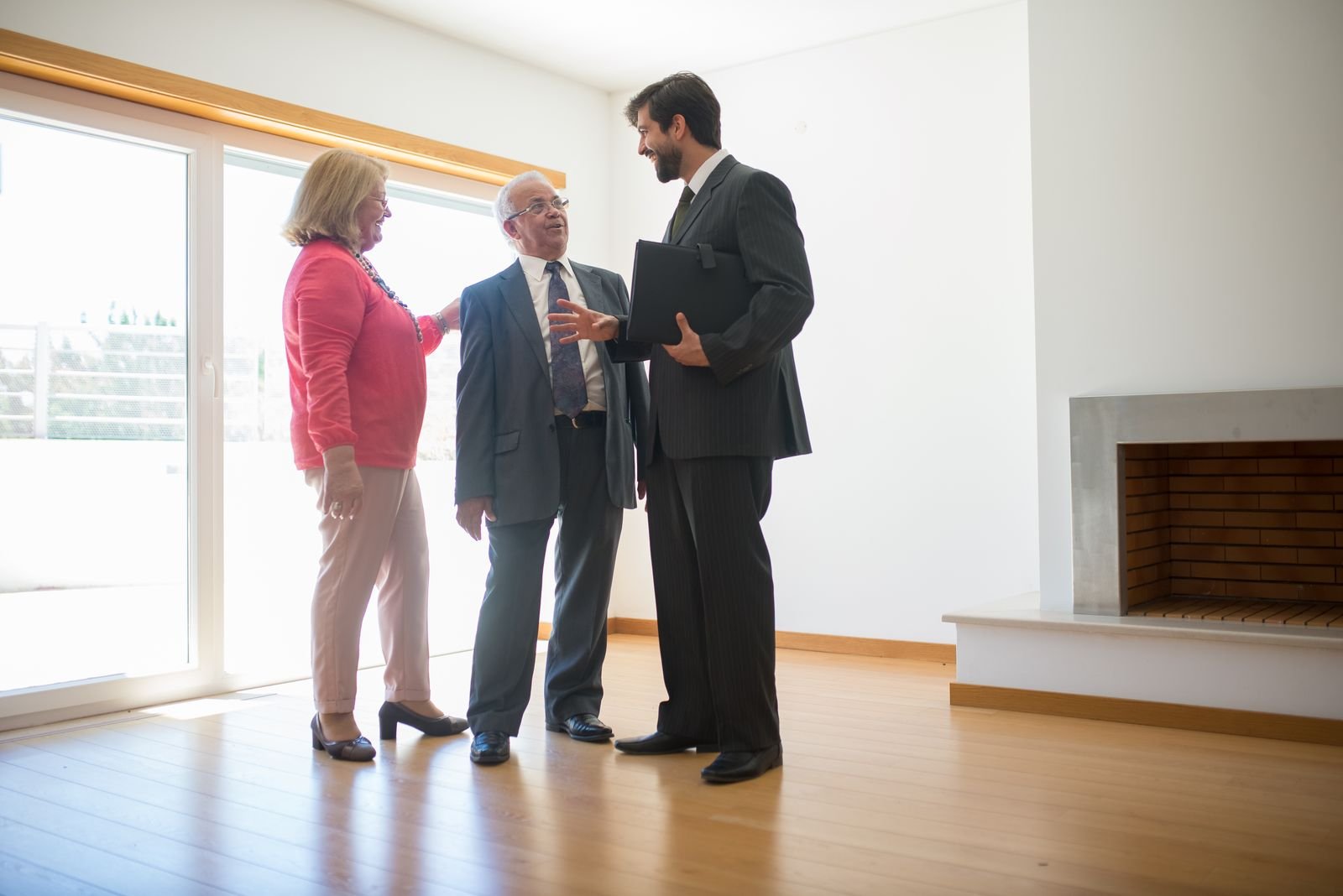 An agent showing a property to buyers